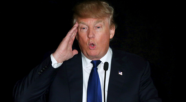 Donald Trump touching his head