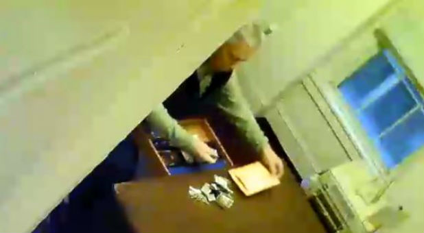 Security footage shows a pastor rifling through church collections.