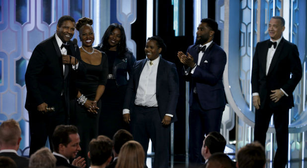 Denzel Washington stands with his family at the Golden Globes.