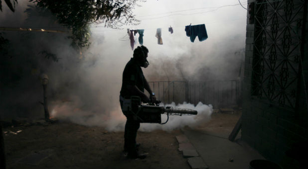 A health worker fumigates the Altos del Cerro neighbourhood as part of preventive measures against the Zika virus and other mosquito-borne diseases in Soyapango, El Salvador.