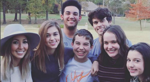 Willie and Korie Robertson's children, including the boy they're adopting (center).