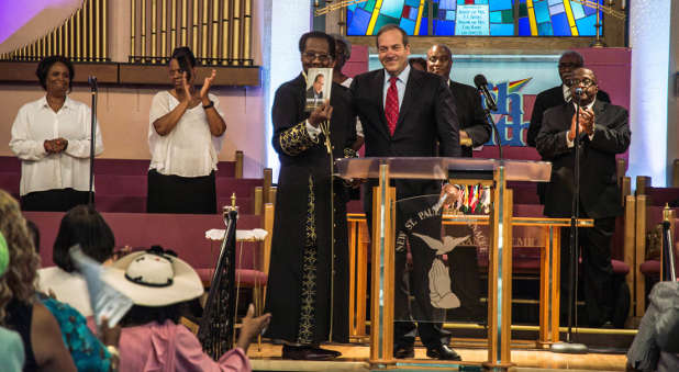 In August 2015 in Detroit, Rabbi Yechiel Eckstein (center right, at podium), founder and president of the International Fellowship of Christians and Jews, visits the New St. Paul Tabernacle Church of God in Christ, which is part of the nation's largest black Pentecostal denomination.