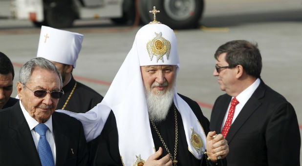Cuba's President Raul Castro walks with Patriarch Kirill, the head of the Russian Orthodox Church