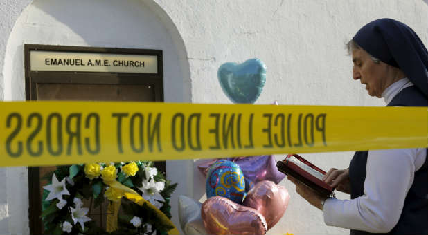 A nun outside the memorial for the victims of the Emanuel AME Church shooting.