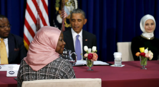 Muslim American community leaders sit for a roundtable discussion with U.S. President Barack Obama (back C) at the Islamic Society of Baltimore mosque.