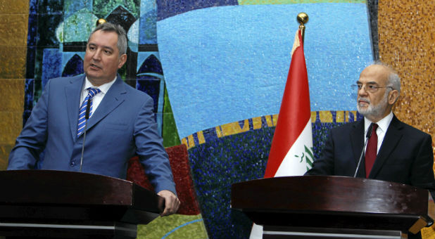 Russia's Deputy Prime Minister Dmitry Rogozin (L) speaks during a news conference with Iraq's Foreign Minister Ibrahim al-Jaafari in Baghdad