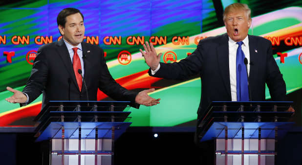 Republican U.S. presidential candidates Marco Rubio (L) and Donald Trump speak simultaneously as they discuss an issue during the debate sponsored by CNN for the 2016 Republican U.S. presidential candidates in Houston, Texas, February 25, 2016.
