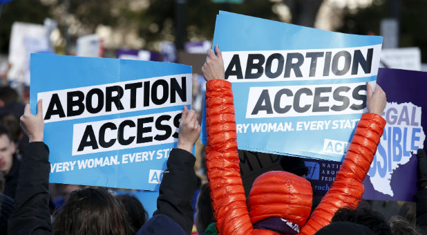 Abortion activists protest outside the Supreme Court.