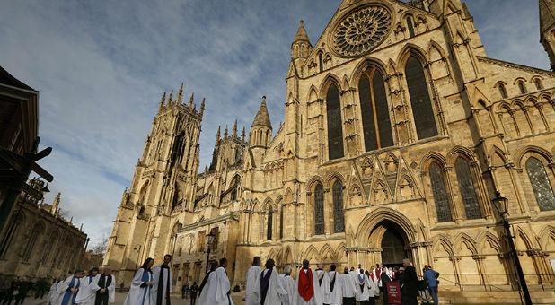 Members of the clergy enter York Minster before a service to consecrate the Rev. Libby Lane as the first female bishop in the Church of England,