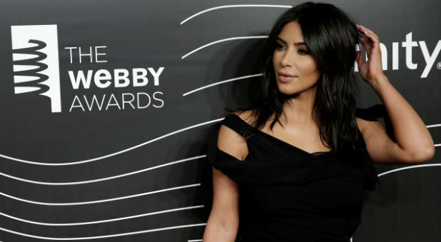 Kim Kardashian West poses as she arrives for the 20th Annual Webby Awards in Manhattan