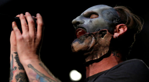 Corey Taylor of Slipknot performs after a news conference to announce the