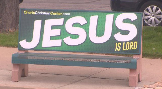 A pastor says he was prohibited from advertising the name of Jesus.