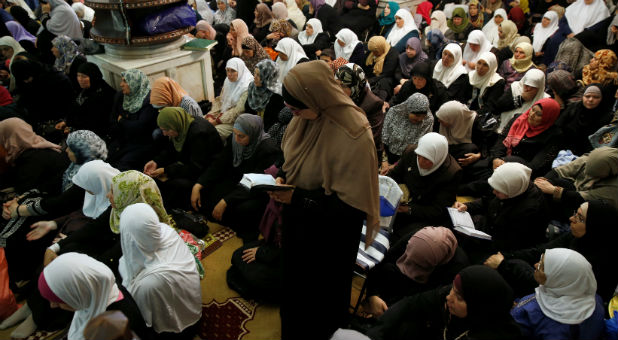 Muslim women pray on the second Friday of the holy month of Ramadan inside the Dome of the Rock