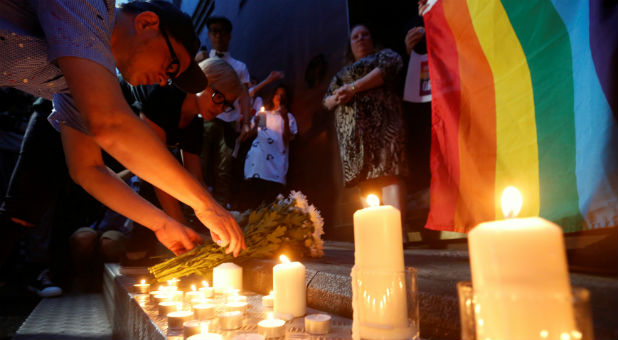 Residents of Hong Kong light a vigil for the victims of the Orlando massacre.