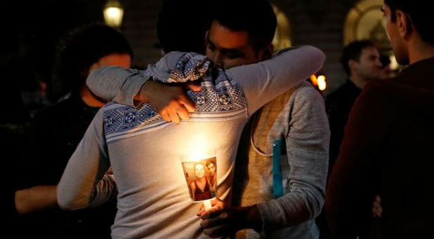 People attend a candlelight vigil for the victims of the Orlando attack against a gay night club, held in San Francisco.