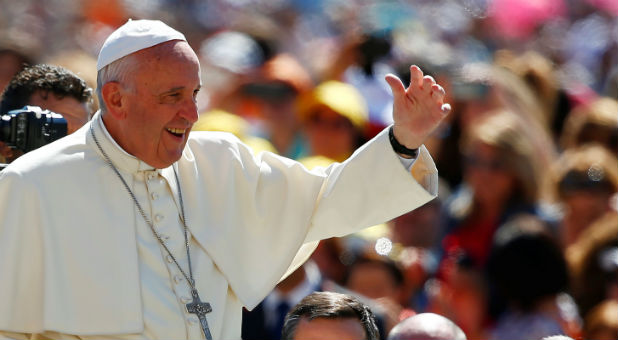 Pope Francis waves as he arrives to lead a special Jubilee audience in Saint Peter's square at the Vatican