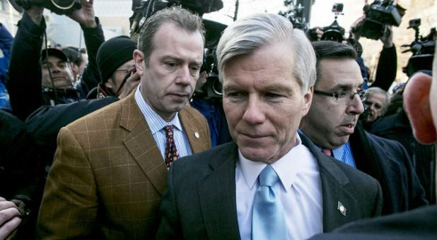 Former Virginia Governor Robert McDonnell is surrounded by members of the media after his sentencing hearing in Richmond