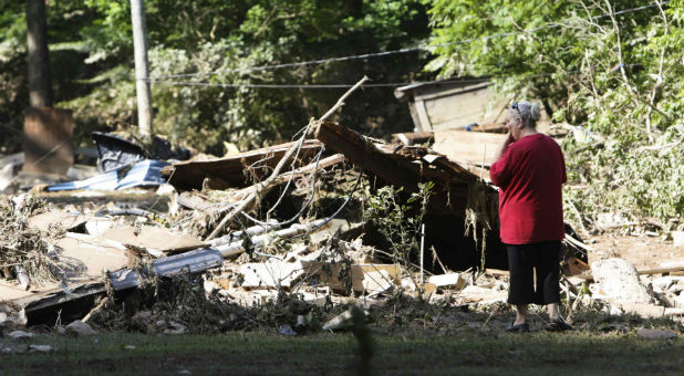 Emma Allen, 58, looks at the remnants of her damaged home after flooding in Falling Rock, West Virginia.