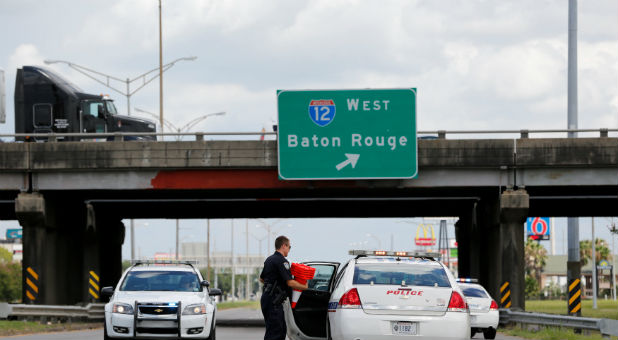 Police block road in Baton Rouge after gunman kills three police.