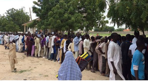 Internally displaced people queuing for relief materials in Maiduguri, Borno State.