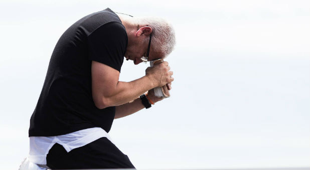 Louie Giglio prays over the crowd at Together 2016.