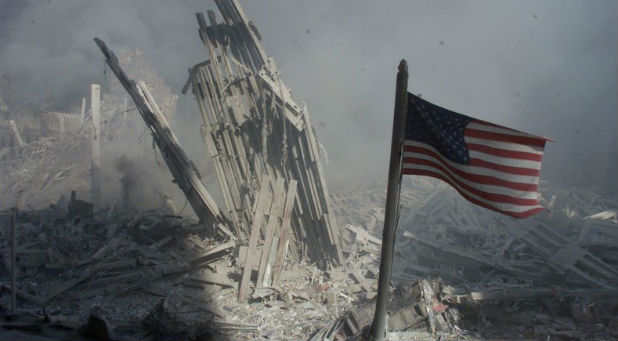 An American flag flies near the base of the destroyed World Trade Center in New York, in this file photo from September 11, 2001, taken after the collapse of the towers.