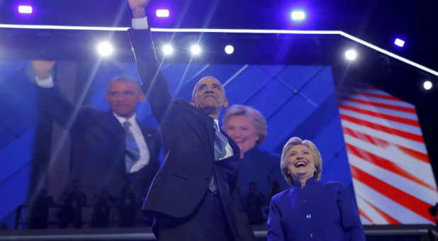 U.S. President Barack Obama and Democratic nominee for president Hillary Clinton appear onstage together after President Obama addressed the third night of the 2016 Democratic National Convention in Philadelphia