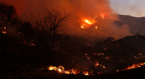 Fire burns brush on a hillside during the so-called Sand Fire in the Angeles National Forest near Los Angeles, California