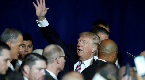 U.S. Republican presidential nominee Donald Trump waves after speaking at the Veterans of Foreign Wars Convention in Charlotte