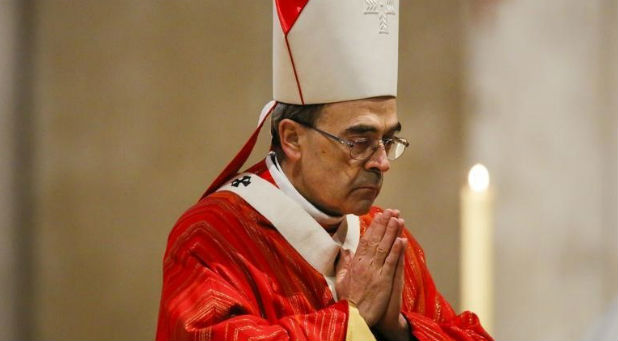 French Archbishop Philippe Barbarin attends a Good Friday mass in Saint-Jean Cathedral in Lyon, France.