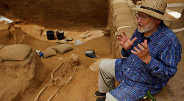 Professor Lawrence E. Stager, Dorot Research Professor of the Archaeology of Israel, speaks during an interview with Reuters near a partly unearthed skeleton at excavation site of the first-ever Philistine cemetery at Ashkelon National Park in southern Israel.