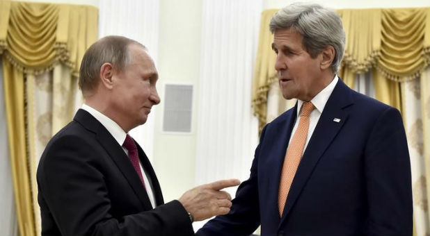 Russian President Vladimir Putin speaks with U.S. Secretary of State John Kerry during a meeting at the Kremlin in Moscow.
