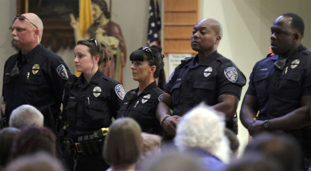Police officers attend a church service after a fatal shooting of Baton Rouge policemen, at Saint John the Baptist Church in Zachary, Louisiana.