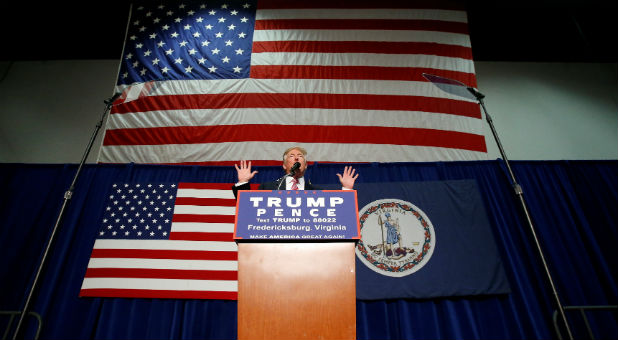 Republican presidential nominee Donald Trump speaks on stage during a campaign rally