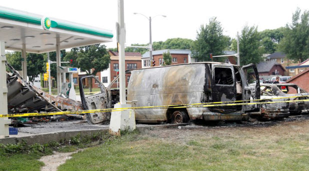 A burned down gas station is seen after disturbances following the police shooting of a man in Milwaukee, Wisconsin