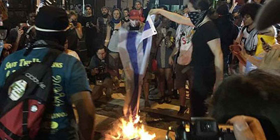 Burning Israeli flags