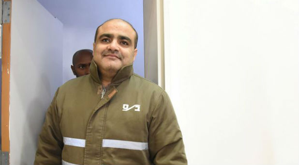 Palestinian Mohammad El Halabi, front, a manager of operations in the Gaza Strip for U.S.-based Christian charity World Vision, is seen before a hearing at the Beersheba district court in southern Israel