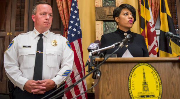 altimore Mayor Stephanie Rawlings-Blake speaks next to Interim Police Commissioner Kevin Davis during a news conference in Baltimore, Maryland, U.S. July 8, 2015.