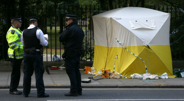 Police officers stand near a forensics tent after a knife attack in Russell Square in London, Britain August 4, 2016.
