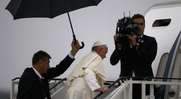 Pope Francis enters the plane during departure at Balice airport near Krakow, Poland.