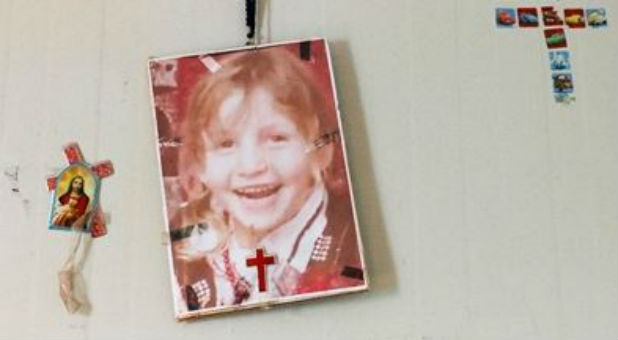 Christine's photo hangs on the wall of her family's caravan, a faint reminder of the lost child.