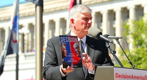 Franklin Graham addresses prayer in the upcoming election while holding a copy of 'Decision' magazine.