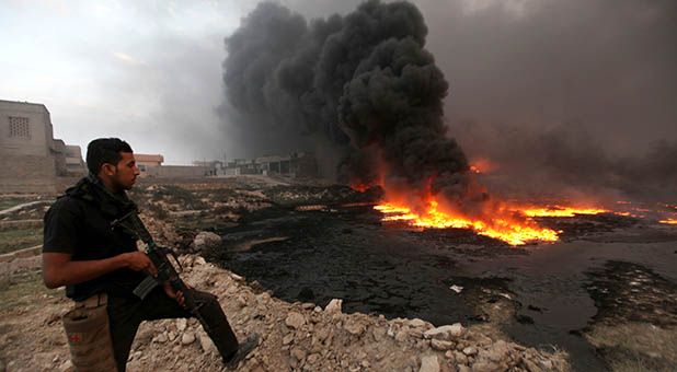 Iraqi Security at Burning Oil Field