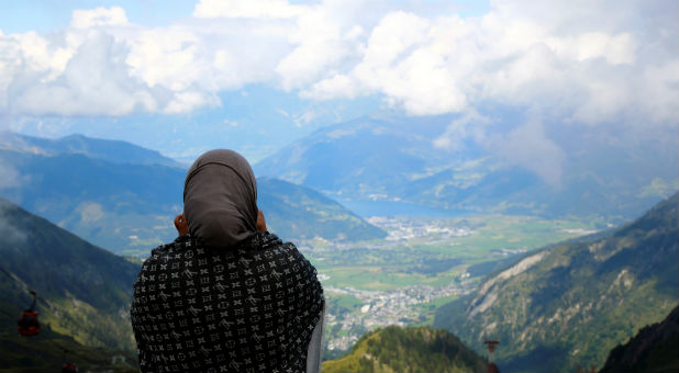 An Arab tourist looks down from Kitzsteinhorn mountain near Zell am See, Austria