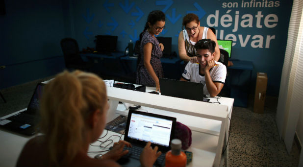 People work at the media platform OnCuba office in Havana, Cuba