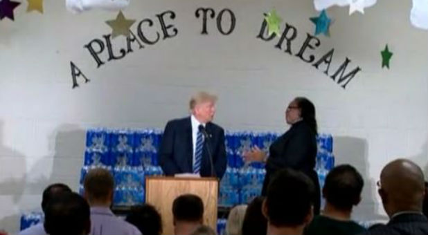 During a visit to a church in Flint, Michigan, U.S. Republican presidential nominee Donald Trump is chastised by the pastor who said she invited him to the church to