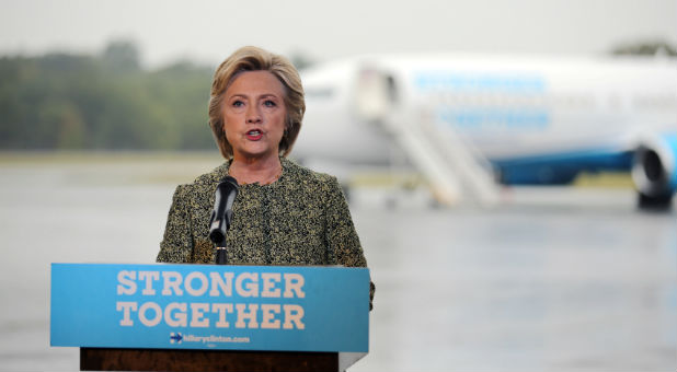 U.S. Democratic presidential candidate Hillary Clinton speaks to the media before boarding her campaign plane at the Westchester County airport in White Plains, New York