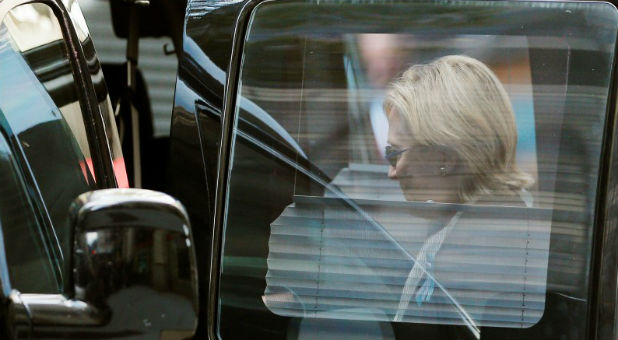 U.S. Democratic presidential candidate Hillary Clinton climbs into her van outside her daughter Chelsea's home in New York