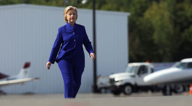 U.S. Democratic presidential candidate Hillary Clinton walks to board her campaign plane