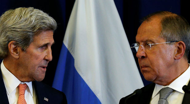 John Kerry and Russian Foreign Minister Sergei Lavrov hold a press conference in Geneva